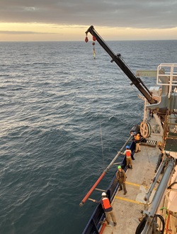 Boat sailing through water.